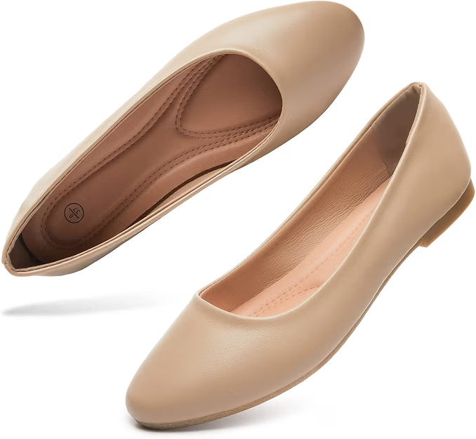 Pair of nude beige flats selected to complement a neutral business casual outfit